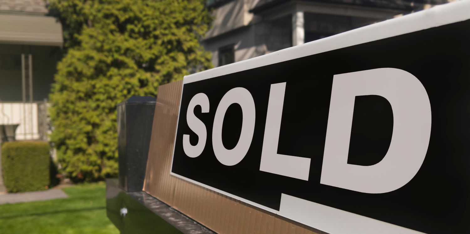 sold_sign Sold home sign in front yard