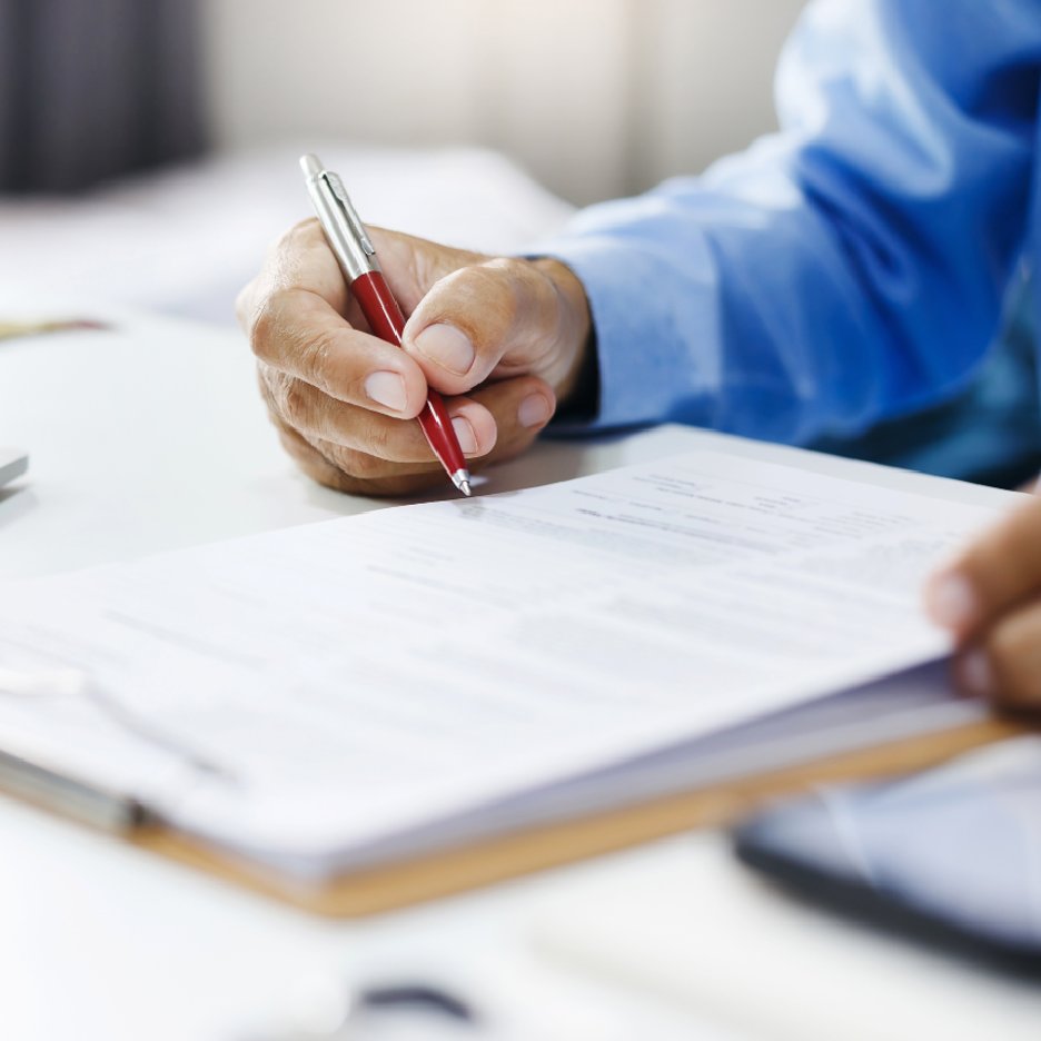 city_permits A man reviewing a building permit application